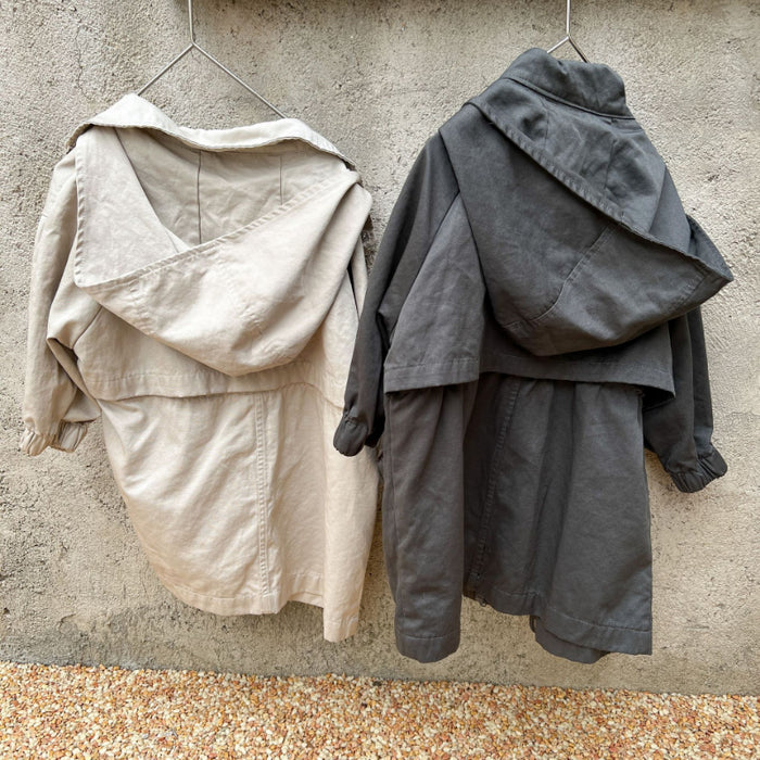Cappotto a vento con cappuccio di media lunghezza in tinta unita per ragazzi e ragazze primaverili Trench casual con cerniera allentata per bambini