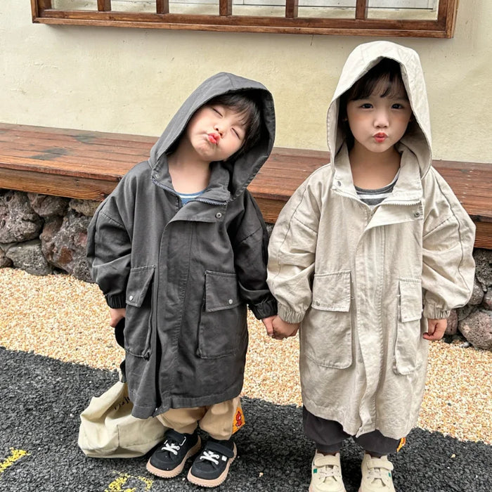 Cappotto a vento con cappuccio di media lunghezza in tinta unita per ragazzi e ragazze primaverili Trench casual con cerniera allentata per bambini