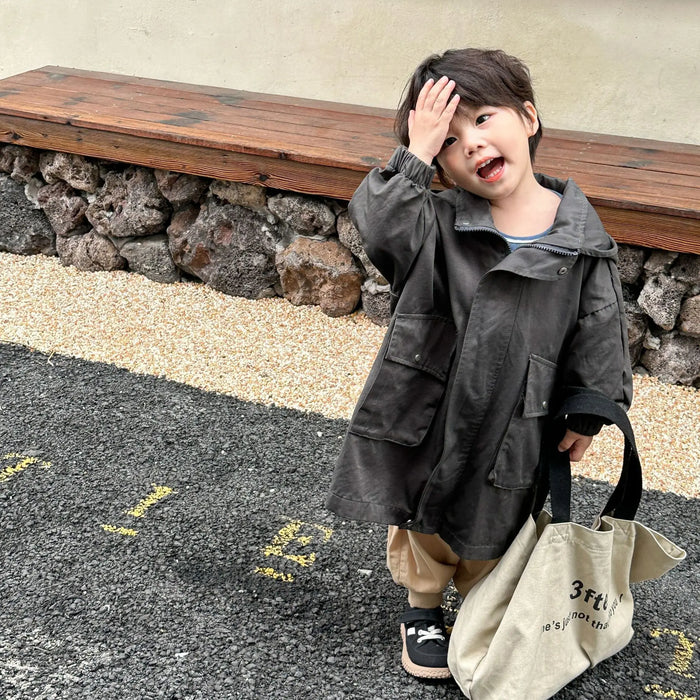 Cappotto a vento con cappuccio di media lunghezza in tinta unita per ragazzi e ragazze primaverili Trench casual con cerniera allentata per bambini